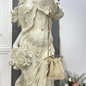 Monogram Empreinte embossed supple grained cowhide leather. Grained cowhide-leather trim