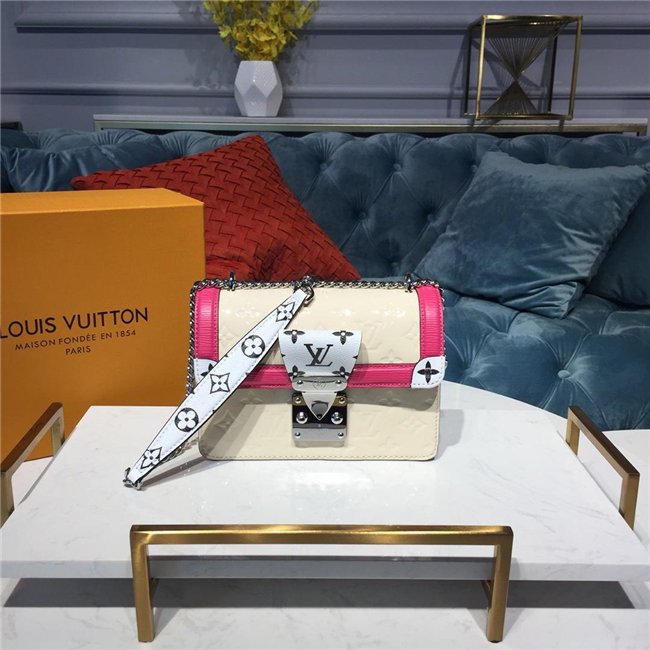 hardware inspired by Louis Vuitton trunks