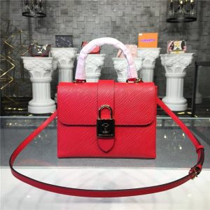 oversized gold-metal LV padlock closure