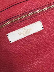 Valentino Rockstud Rolling Red with turquoise stone